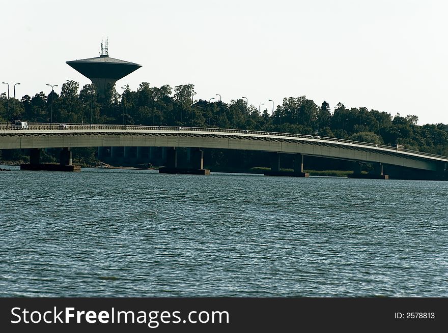 Modern bridge and a water tower. Modern bridge and a water tower