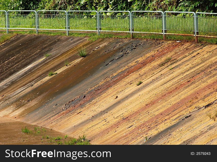 Fence and big drain in the parks