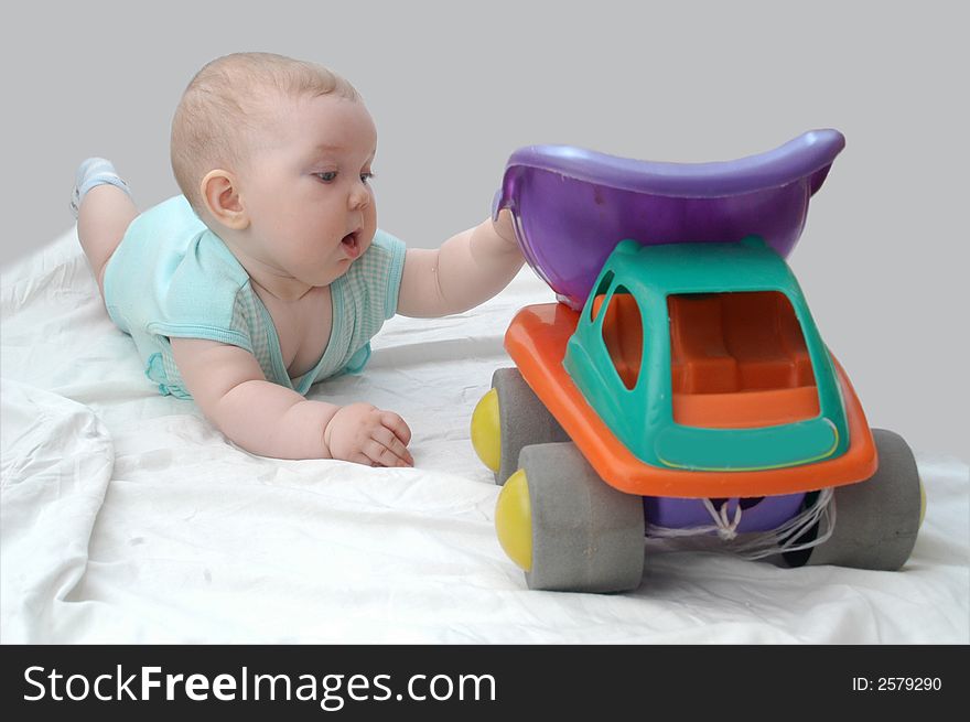 A child playing with toy-lorry