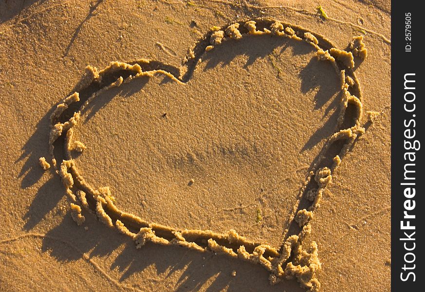 Heart on the beach sand