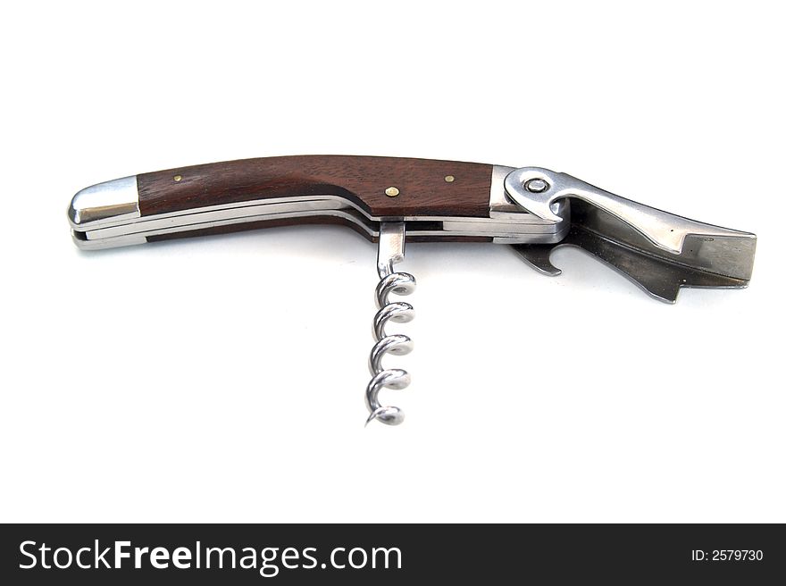 Corkscrew with wooden handle and cork remover opened. Corkscrew with wooden handle and cork remover opened