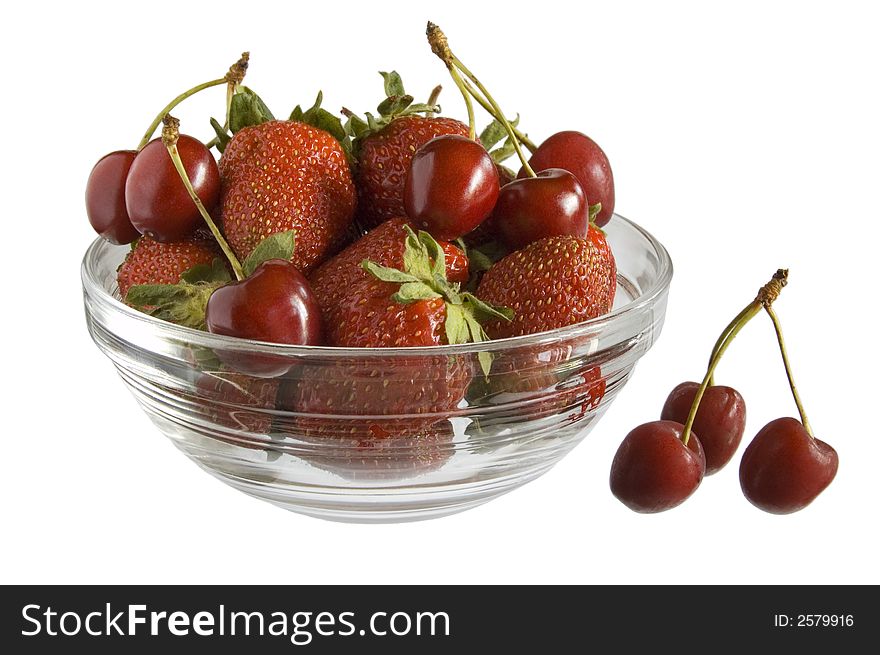 Strawberries and cherries in bowl on white