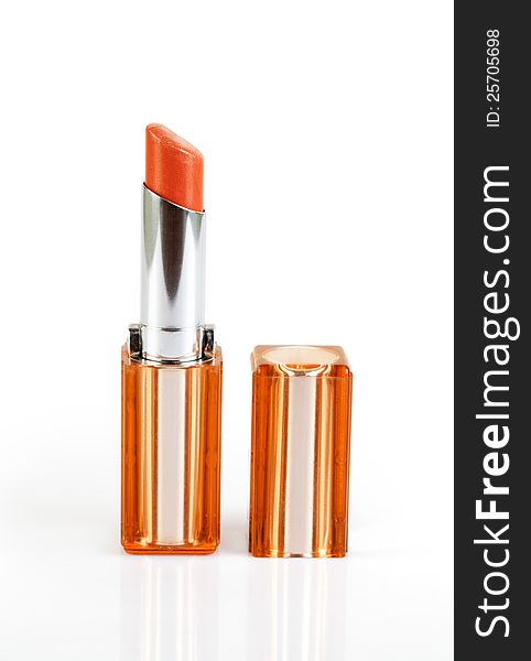 Red(orange) lipstick isolated over the white background