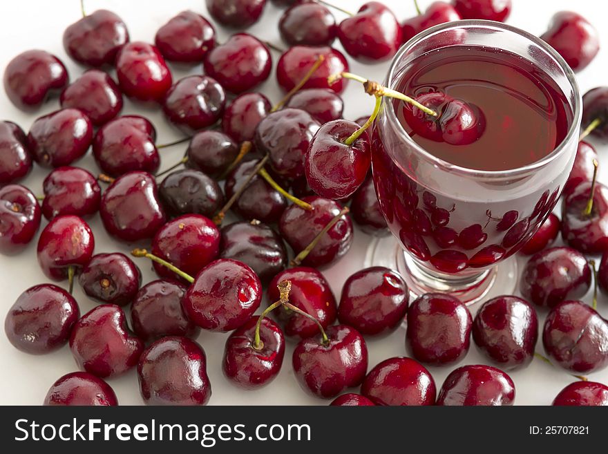 Fresh cold drink with cherry against white background. Fresh cold drink with cherry against white background