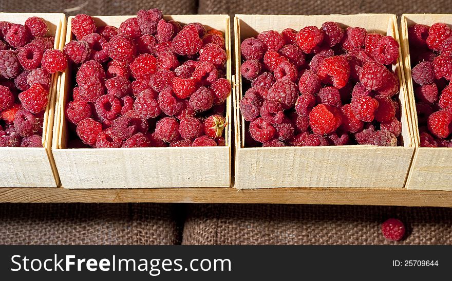 Small Containers Of Raspberries Ready For Sale