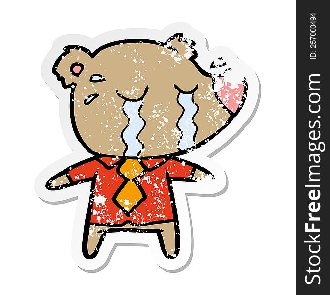 distressed sticker of a cartoon crying bear in shirt