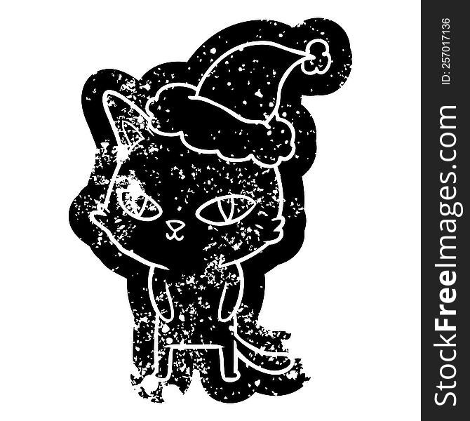 quirky cartoon distressed icon of a cat with bright eyes wearing santa hat