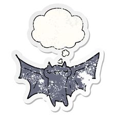 Cute Cartoon Halloween Bat And Thought Bubble As A Distressed Worn Sticker Stock Photo