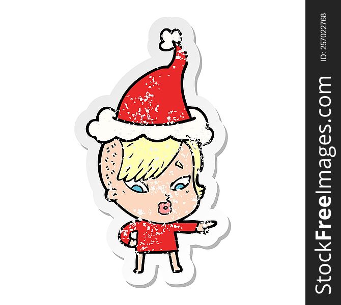 hand drawn distressed sticker cartoon of a surprised girl pointing wearing santa hat