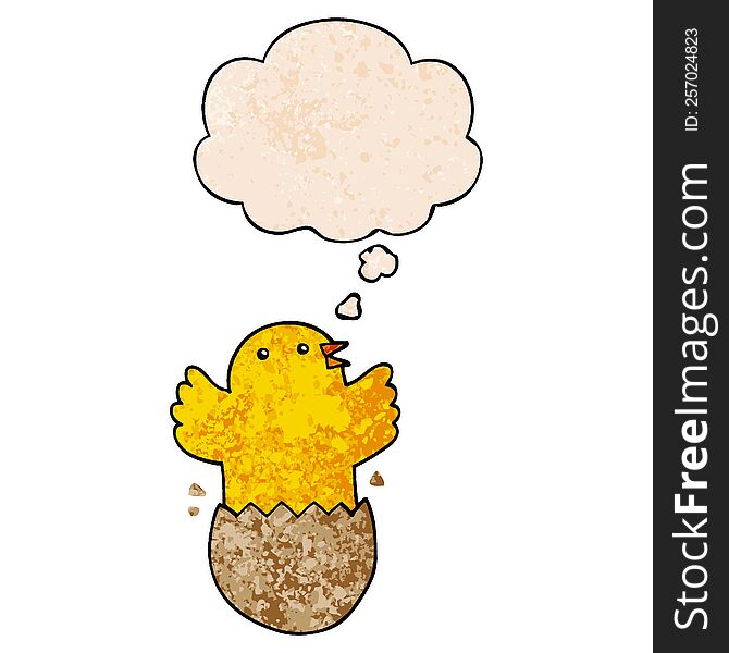 cartoon hatching bird with thought bubble in grunge texture style. cartoon hatching bird with thought bubble in grunge texture style