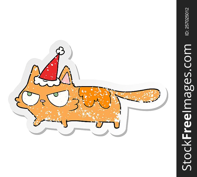 hand drawn distressed sticker cartoon of a angry cat wearing santa hat