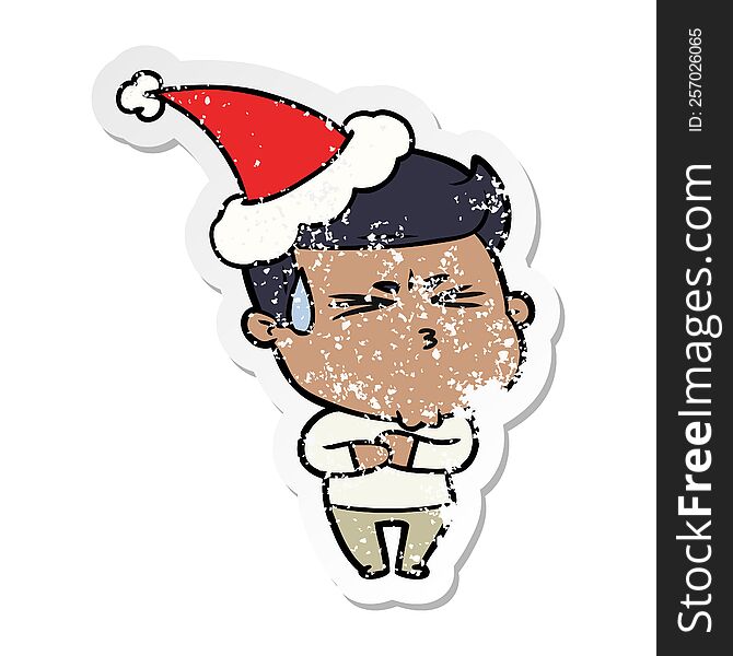 hand drawn distressed sticker cartoon of a frustrated man wearing santa hat
