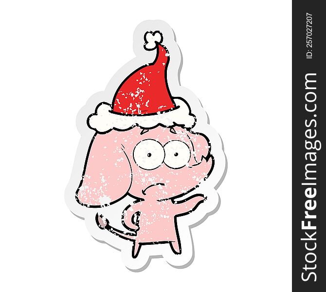 hand drawn distressed sticker cartoon of a unsure elephant wearing santa hat