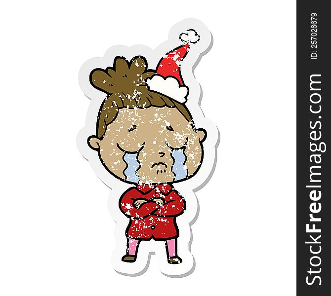 Distressed Sticker Cartoon Of A Crying Woman Wearing Santa Hat