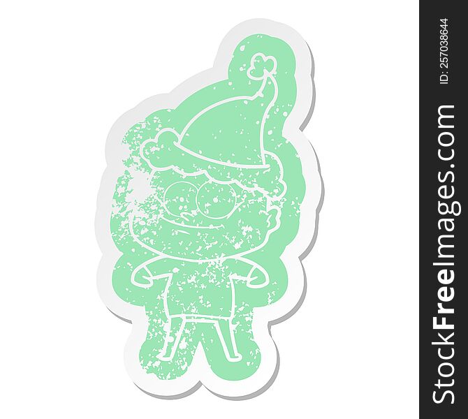 Cartoon Distressed Sticker Of A Bald Man Staring Wearing Santa Hat