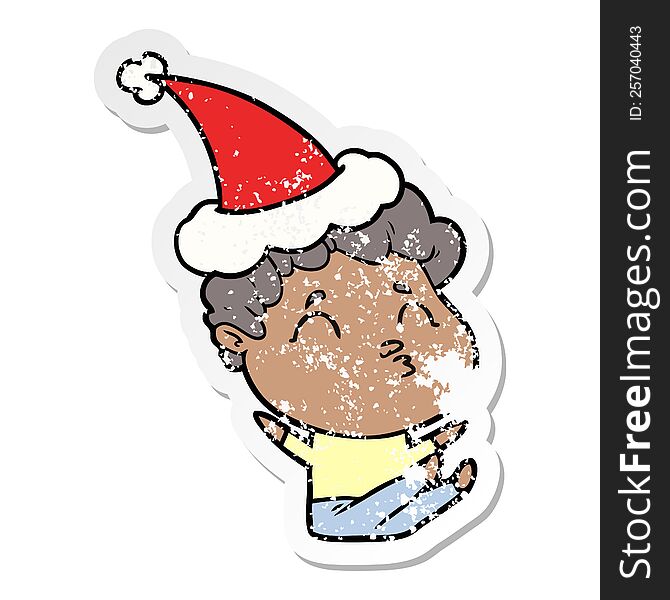 Distressed Sticker Cartoon Of A Man Pouting Wearing Santa Hat
