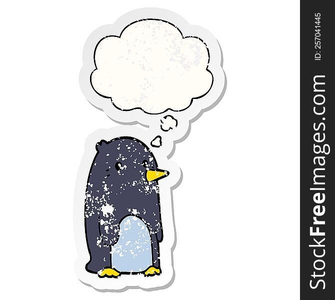 cartoon penguin with thought bubble as a distressed worn sticker