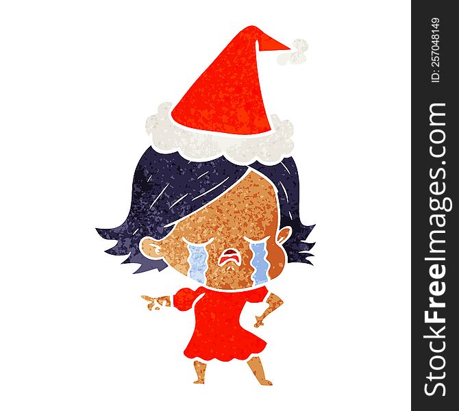 hand drawn retro cartoon of a girl crying and pointing wearing santa hat