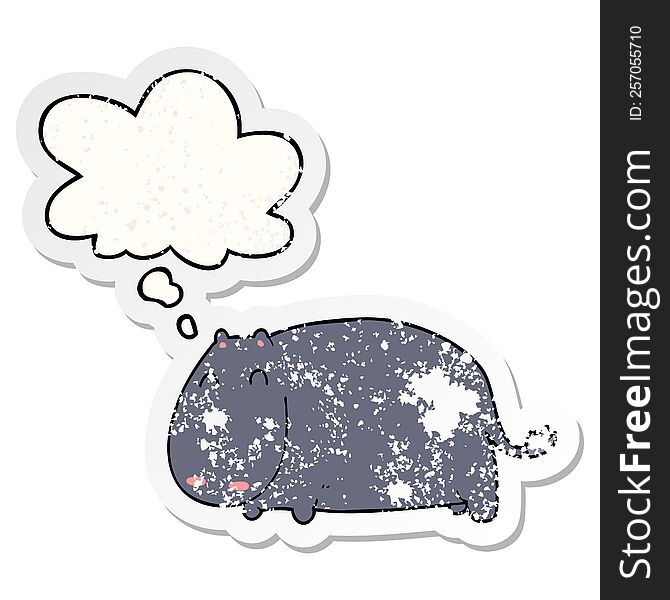 cartoon hippo with thought bubble as a distressed worn sticker