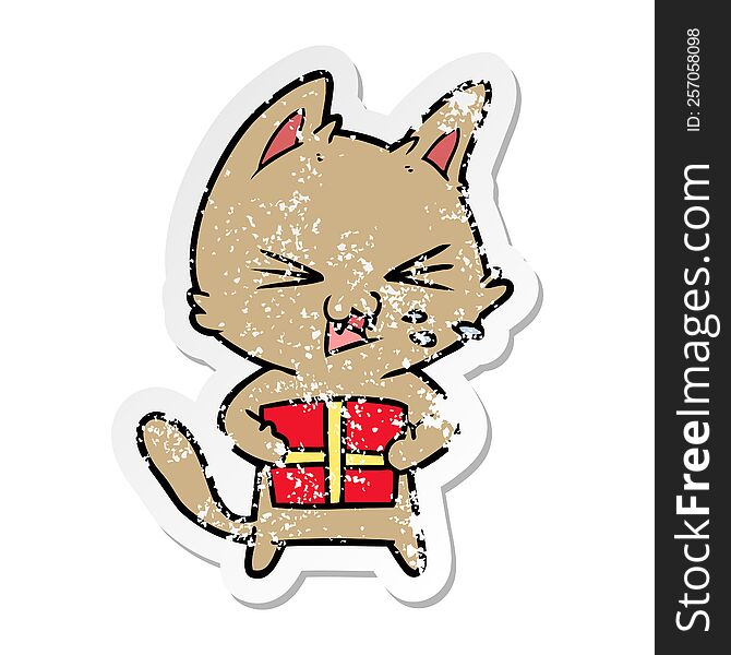 distressed sticker of a cartoon hissing cat with christmas present