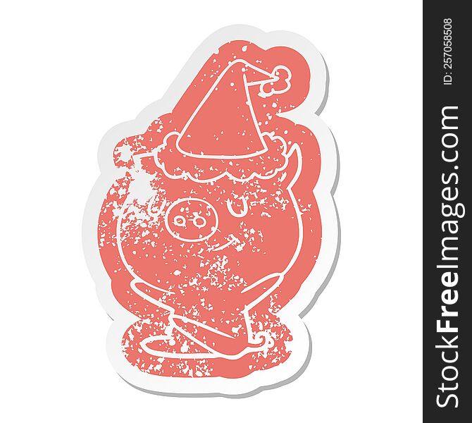 happy quirky cartoon distressed sticker of a pig wearing santa hat