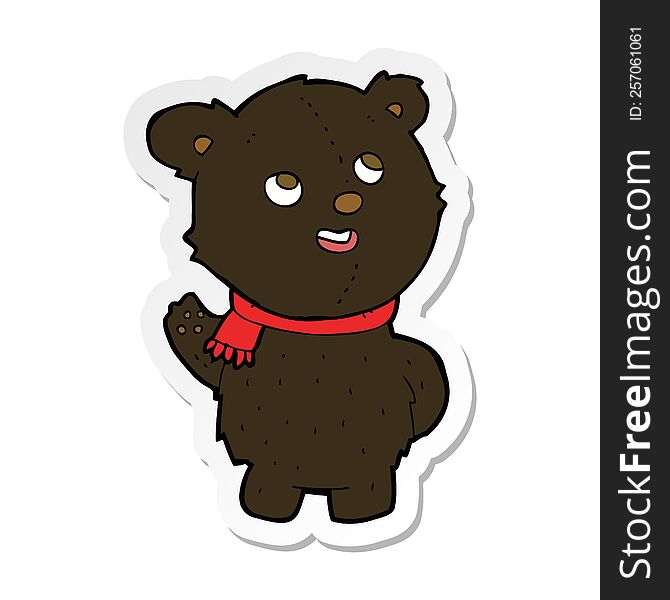 sticker of a cartoon cute black bear cub