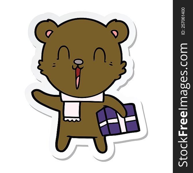 sticker of a happy cartoon bear with gift