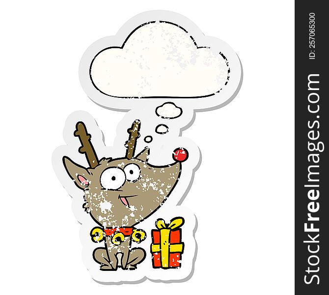 cartoon christmas reindeer and thought bubble as a distressed worn sticker