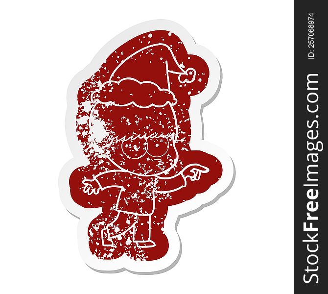 nervous quirky cartoon distressed sticker of a boy wearing santa hat