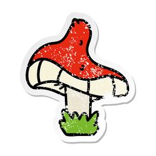 Distressed Sticker Cartoon Doodle Of A Single Mushroom Stock Photos