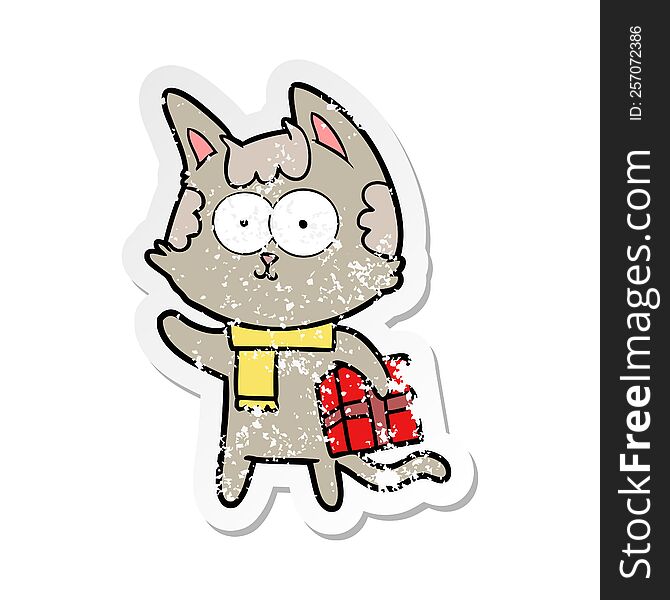distressed sticker of a happy cartoon cat with christmas present