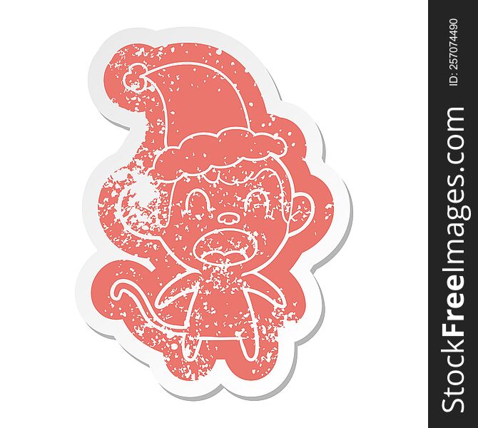 shouting quirky cartoon distressed sticker of a monkey wearing santa hat