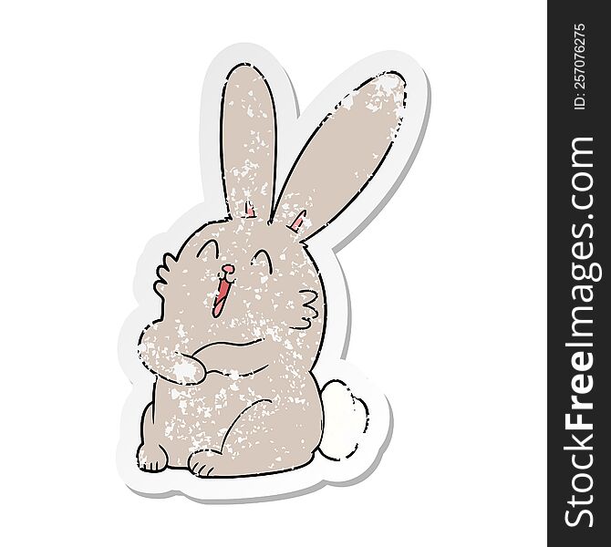 distressed sticker of a cartoon laughing bunny rabbit
