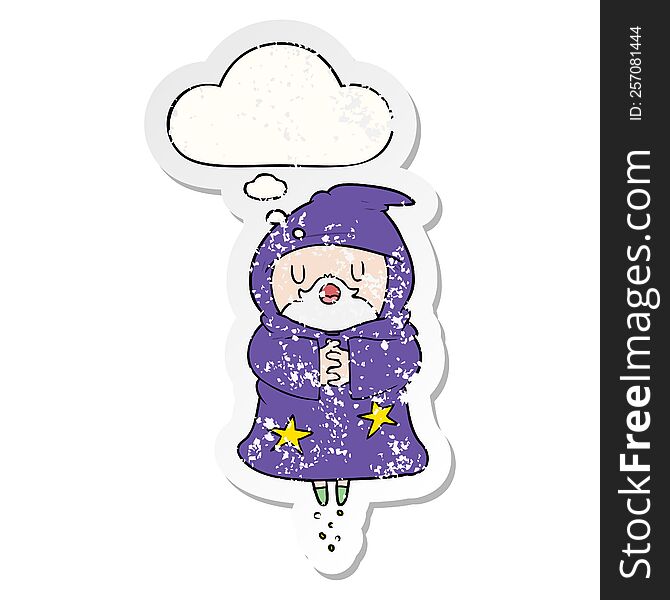 cartoon floating wizard with thought bubble as a distressed worn sticker