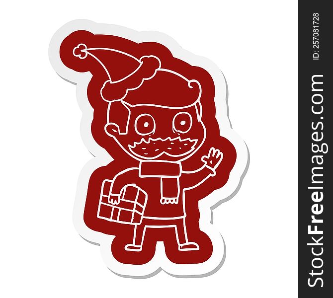 Cartoon  Sticker Of A Man With Mustache And Christmas Present Wearing Santa Hat