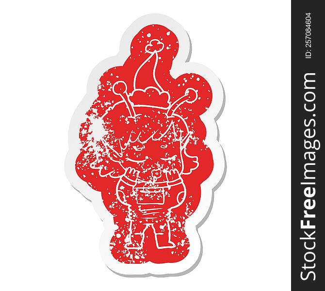 Cartoon Distressed Sticker Of A Alien Girl Wearing Santa Hat