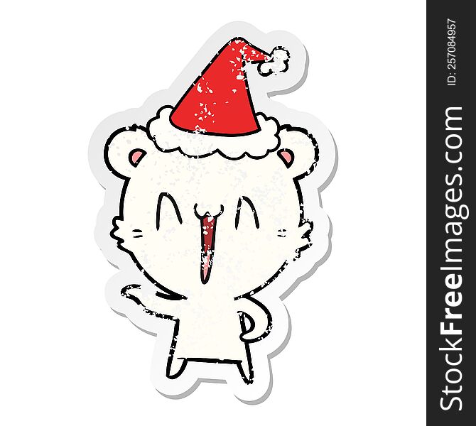 laughing polar bear hand drawn distressed sticker cartoon of a wearing santa hat