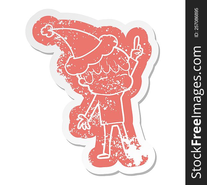 quirky cartoon distressed sticker of a curious boy wearing santa hat