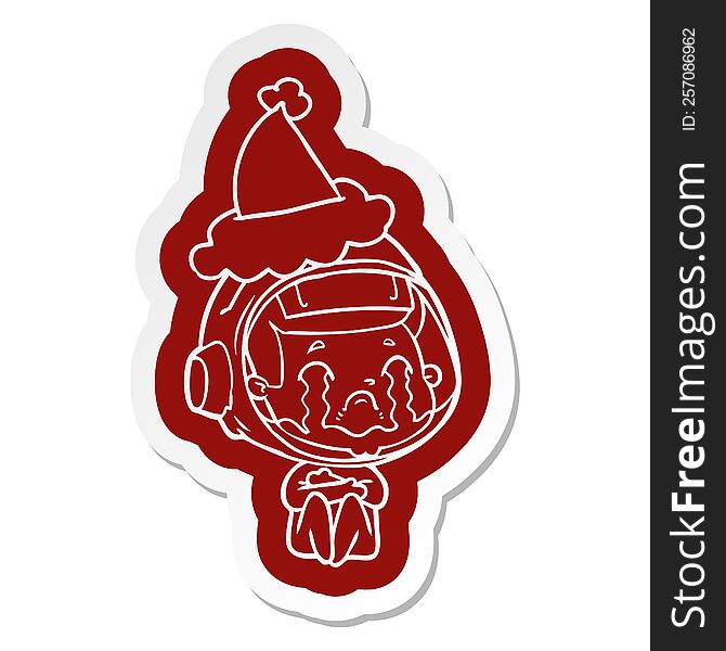 Cartoon  Sticker Of A Crying Astronaut Wearing Santa Hat