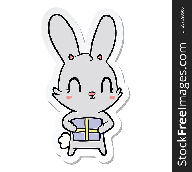Sticker Of A Cute Cartoon Rabbit With Present