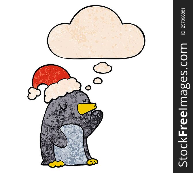 cute cartoon christmas penguin with thought bubble in grunge texture style. cute cartoon christmas penguin with thought bubble in grunge texture style