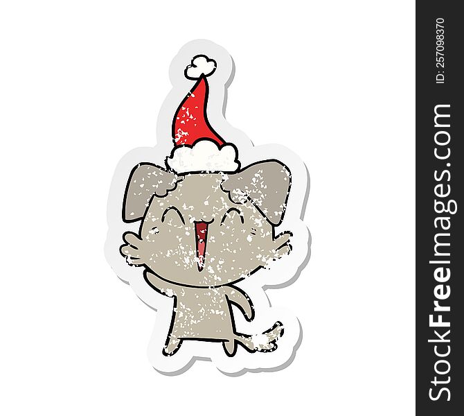 waving little dog hand drawn distressed sticker cartoon of a wearing santa hat