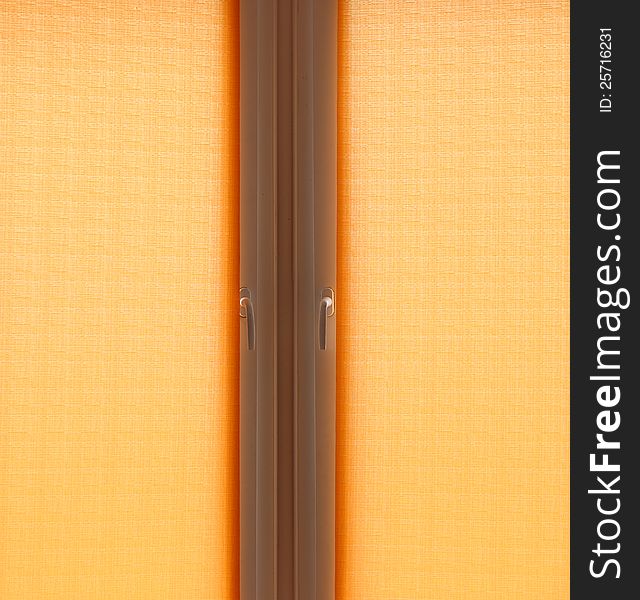 Closed window with orange curtains. Closed window with orange curtains