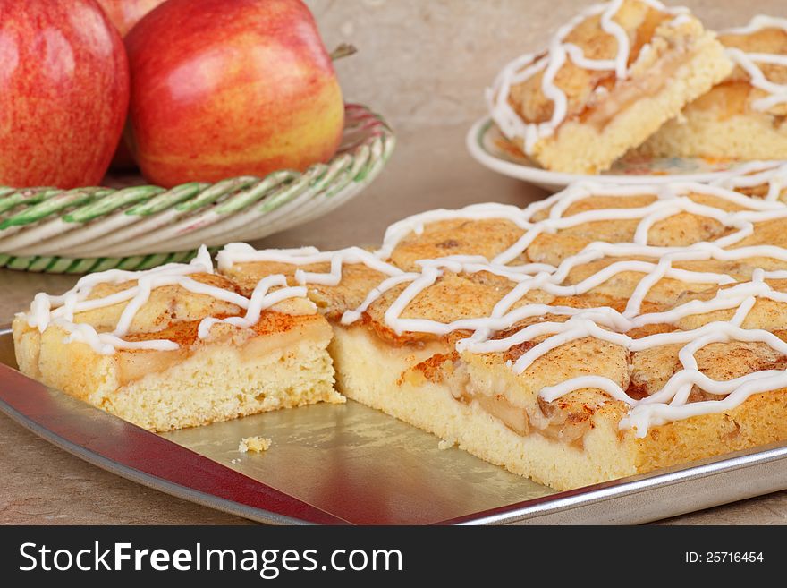 Baking sheet with apple cake on a kitchen counter