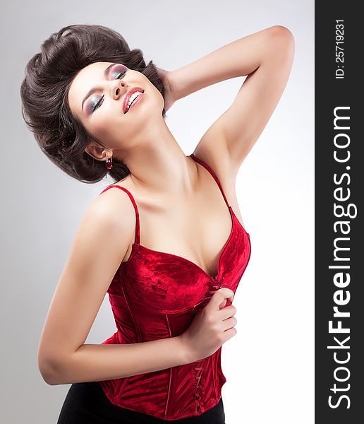 Smiling Dreamy Graceful Woman. Studio Fashion