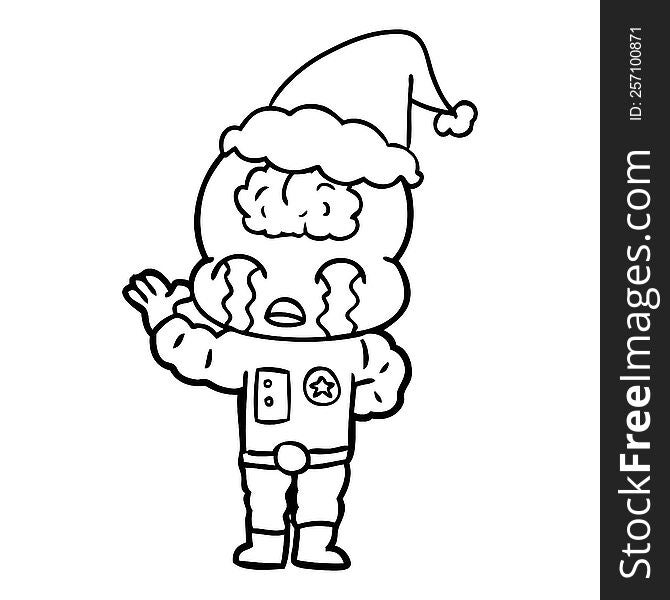 hand drawn line drawing of a big brain alien crying wearing santa hat