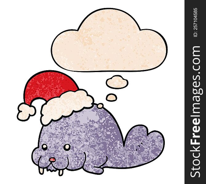 cartoon christmas walrus with thought bubble in grunge texture style. cartoon christmas walrus with thought bubble in grunge texture style