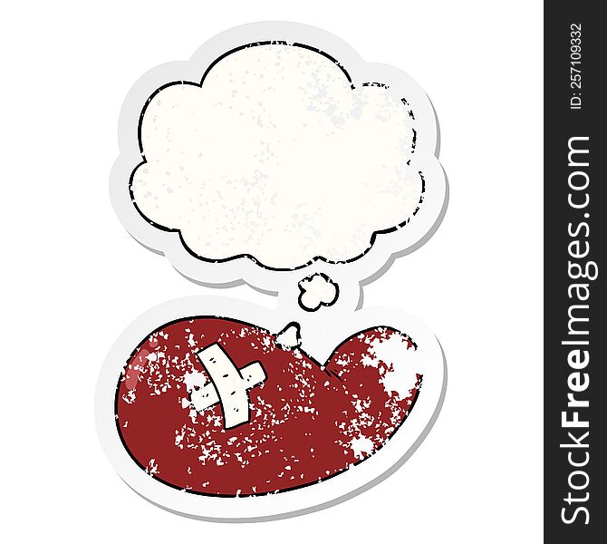 cartoon injured gall bladder with thought bubble as a distressed worn sticker