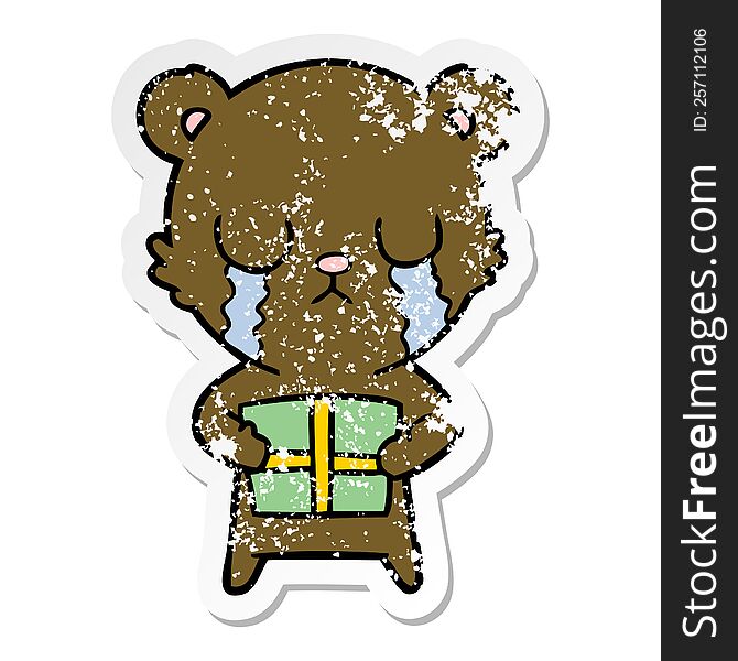 Distressed Sticker Of A Crying Cartoon Bear With Present