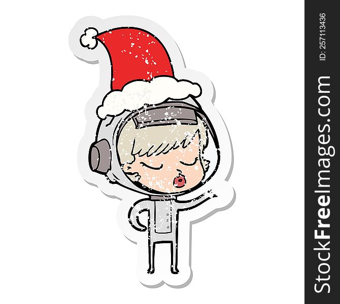 hand drawn distressed sticker cartoon of a pretty astronaut girl wearing santa hat